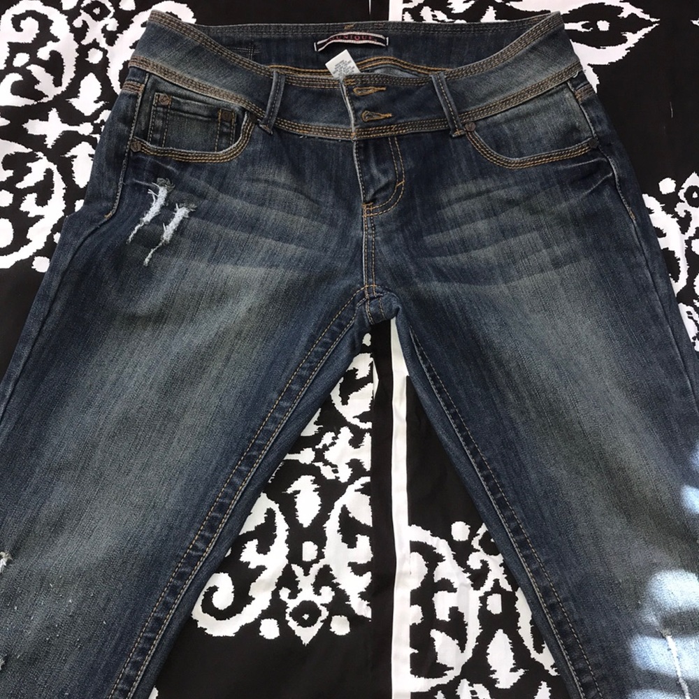 Blue jeans with distressed marks